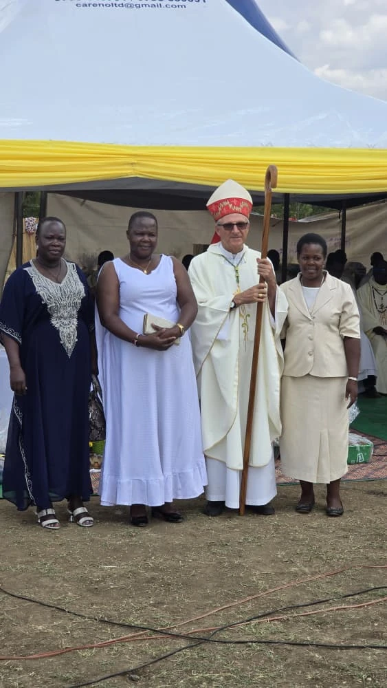 Catholic bishop and school community members